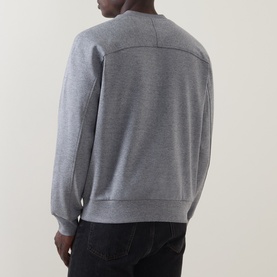 Model wearing Boss Black Casual Soleri Logo Sweatshirt in Open Grey, crew neck with ribbed trims, back view, styled with dark trousers.