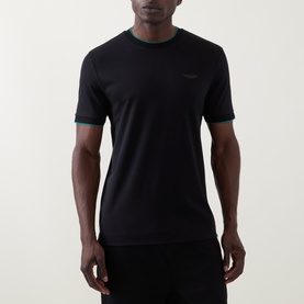 Model wearing Boss Black Casual Thompson Logo T-Shirt in black with contrast green ribbed cuffs and crew neck, tonal chest logo