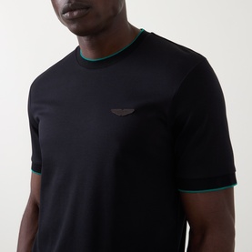 Model wearing Boss Black Casual Thompson Logo T-Shirt in black with green contrast tipping at crew neck and cuffs, tonal chest logo
