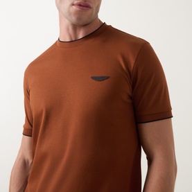 Model wearing Boss Black Casual medium brown crew neck T-shirt with contrast tipping detail and tonal chest logo badge
