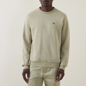 Model wearing Boss Black Casual C-Sharpe Logo Sweatshirt in dark beige, crew neck with ribbed trims and chest logo, styled with matching trousers.