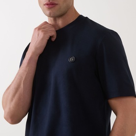 Model wearing Boss Black Casual C-Taut 01 Logo T-Shirt in dark blue, crew neck with short sleeves and chest logo detail