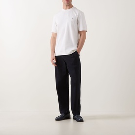 Model wearing Boss Black Casual C-Taut 01 Logo T-Shirt in Open White with black wide-leg trousers and dark loafers.