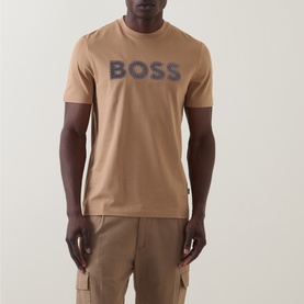 Model wearing Boss Black Casual C-Thompson Logo T-Shirt in medium beige, with navy BOSS chest logo. Styled with beige cargo trousers.