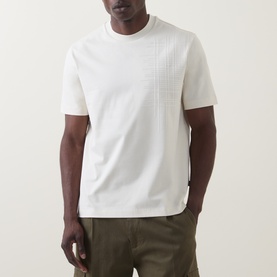 Model wearing Boss Black Casual C-Tigerman Tonal Check T-Shirt in Open White, with tonal check chest detail, styled with olive trousers