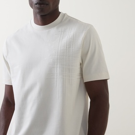 Model wearing Boss Black Casual C-Tigerman Tonal Check T-Shirt in Open White with tonal check graphic on chest and crew neck