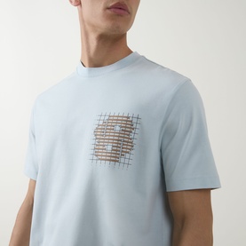 Model wearing Boss Black Casual Tigerman Logo T-Shirt in Open Blue with chest logo graphic, crew neck, short sleeves