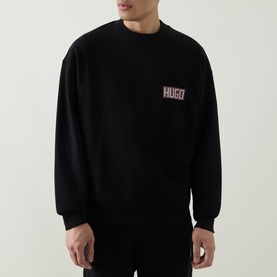 Model wearing Boss Black Casual C-Tigerman Logo Sweatshirt in black, crew neck with dropped shoulders and chest logo detail.