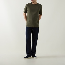 Model wearing Boss Black Casual H-Taut Logo T-Shirt in Open Green with crew neck, styled with navy trousers and white trainers.
