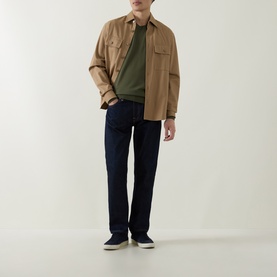 Model wearing Boss Black Casual Leno Knitted Sweater in Open Green, styled with a tan overshirt and dark indigo jeans.