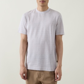 Model wearing Boss Black Casual Thompson Textured Logo T-Shirt in Open White, crew neck, short sleeves, styled with tan trousers