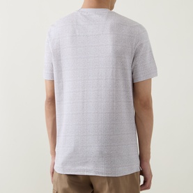 Model wearing Boss Black Casual Thompson Textured Logo T-Shirt in Open White, shot from behind showing textured fabric and straight hem.