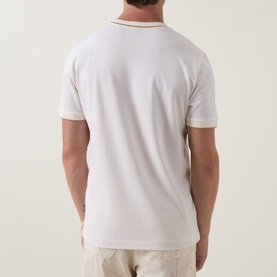 Model wearing Boss Black Casual Thompson Tipped T-Shirt in Open White, rear view showing tipped collar trim and short sleeves, styled with beige