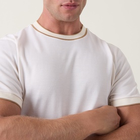 Model wearing Boss Black Casual Thompson Tipped T-Shirt in Open White with tan tipped trim detail at crew neckline and sleeve cuffs.