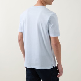 Model wearing Boss Black Casual Open Blue cotton crew neck T-shirt, rear view, styled with dark navy trousers.