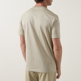 Model wearing Boss Black Casual Thompson Logo T-Shirt in dark beige, back view, crew neck, short sleeves, styled with matching trousers