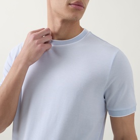 Model wearing Boss Black Casual Thompson Tipped T-Shirt in Open Blue, showing crew neck with contrast tipped trim detail at neckline and sleeves.
