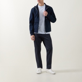 Model wearing Boss Black Casual Thompson Tipped T-Shirt in Open Blue, styled with a navy zip-up hoodie, dark trousers and white trainers.