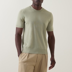 Model wearing Boss Black Casual Umauro Knitted Sweater in dark beige, crew neck, short sleeves, styled with sand chinos