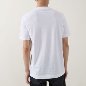 Model wearing Boss Black Casual white crew neck T-shirt, rear view, styled with dark jeans
