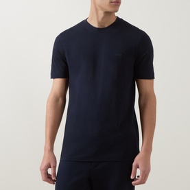 Model wearing Boss Black Casual Thompson Logo T-Shirt in dark blue, crew neck with tonal chest logo, short sleeves and straight hem.