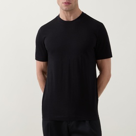 Model wearing Boss Black Casual black crew neck cotton T-shirt, styled with black trousers