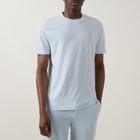 Model wearing Boss Black Casual Open Blue crew neck cotton T-shirt, styled with matching light blue trousers