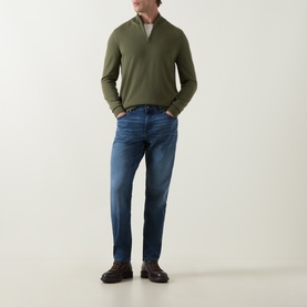 Model wearing Boss Black Casual Ebenji Half-Zip Sweater in Open Green, styled with mid-wash blue jeans and dark brown shoes.
