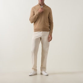 Model wearing Boss Black Casual Benji Half-Zip Sweater in medium beige wool, styled with cream trousers and white trainers.