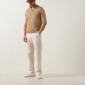Model wearing Boss Black Casual Benji Half-Zip Sweater in medium beige wool, styled with cream trousers and white trainers.