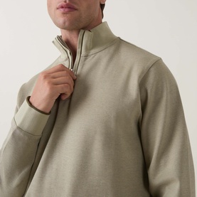 Model wearing Boss Black Casual Sidney Half-Zip Sweatshirt in dark beige, showing high neckline, half-zip fastening and tipped detailing detail