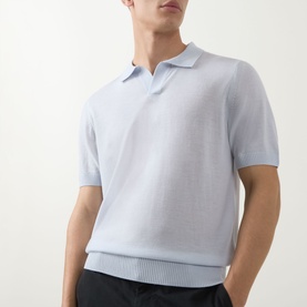 Model wearing Boss Black Casual H Lantoni Logo Polo Sweater in Open Blue, fine-knit wool with ribbed trims and V-neck collar, styled with dark