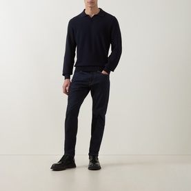 Model wearing Boss Black Casual H Lomarino Logo Polo Sweater in dark blue with dark jeans and black lace-up boots.