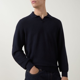 Model wearing Boss Black Casual H Lomarino Logo Polo Sweater in dark blue, featuring open polo collar, textured knit and ribbed trims, styled with