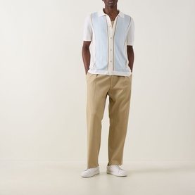 Model wearing Boss Black Casual Lastro Colour-Blocked Shirt in Open White, styled with tan trousers and white trainers.