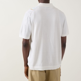 Model wearing Boss Black Casual Lastro Colour-Blocked Shirt in Open White, short sleeves, flat collar, paired with beige trousers. Rear view.
