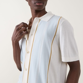 Model wearing Boss Black Casual Lastro Colour-Blocked Shirt in Open White with light blue panels and gold ribbed trim detailing, short sleeves