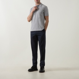 Model wearing Boss Black Casual Open Grey cotton polo shirt, styled with navy trousers and black shoes.