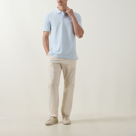 Model wearing Boss Black Casual Open Blue cotton polo shirt, styled with stone chinos and cream trainers