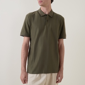Model wearing Boss Black Casual Parlay Polo Shirt in Open Green with textured finish, polo collar, two-button placket and short sleeves