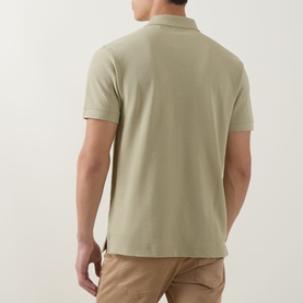 Model wearing Boss Black Casual dark beige cotton polo shirt, rear view, styled with tan chinos.