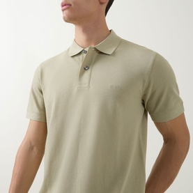Model wearing Boss Black Casual dark beige cotton polo shirt with short sleeves, ribbed collar and two-button placket