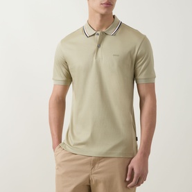 Model wearing Boss Black Casual dark beige cotton polo shirt with contrast tipped collar and cuffs, styled with stone chinos