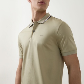 Model wearing Boss Black Casual dark beige cotton polo shirt with contrast tipped collar and cuffs, small logo at chest
