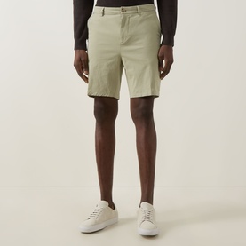 Model wearing Boss Black Casual Kane Chino Shorts in Dark Beige, slim-leg mid-rise fit with belt loops, styled with white trainers.