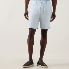 Model wearing Boss Black Casual Peter C Drawstring Shorts in Open Blue, styled with dark loafers, showing straight-leg above-the-knee cut
