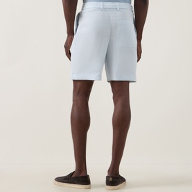 Model wearing Boss Black Casual Peter C Drawstring Shorts in Open Blue, back view, styled with dark slip-on shoes