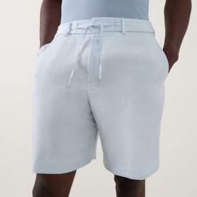 Model wearing Boss Black Casual Peter C Drawstring Shorts in Open Blue, mid-rise straight-leg style with elasticated drawstring waistband and belt
