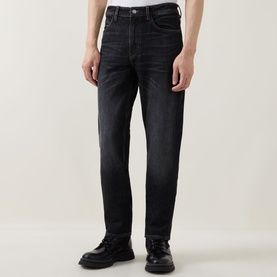 Model wearing Boss Black Casual straight jeans in charcoal, styled with black leather lace-up shoes. Five-pocket design with subtle fading.