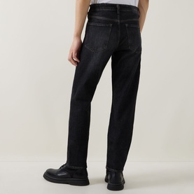 Model wearing Boss Black Casual charcoal straight jeans, rear view, styled with black leather shoes.